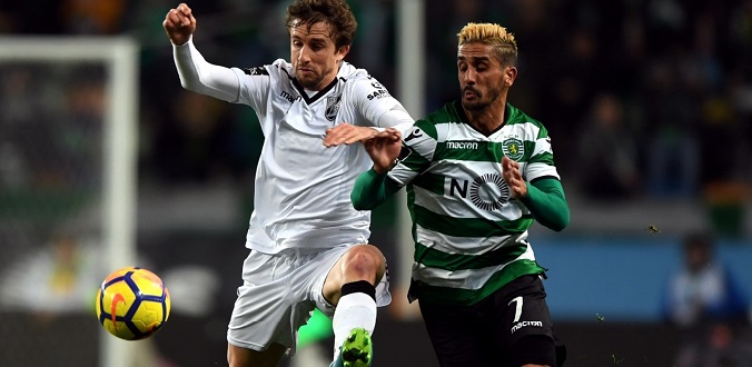LISBON, Feb. 1, 2018 (Xinhua) -- Ruben Ribeiro (R) of Sporting vies with Rafael Miranda of Guimaraes during the Portuguese League soccer match between Sporting and Vitoria Guimaraes in Lisbon, Portugal, Jan. 31, 2018. Sporting won 1-0. (Xinhua/Zhang Liyun/IANS)